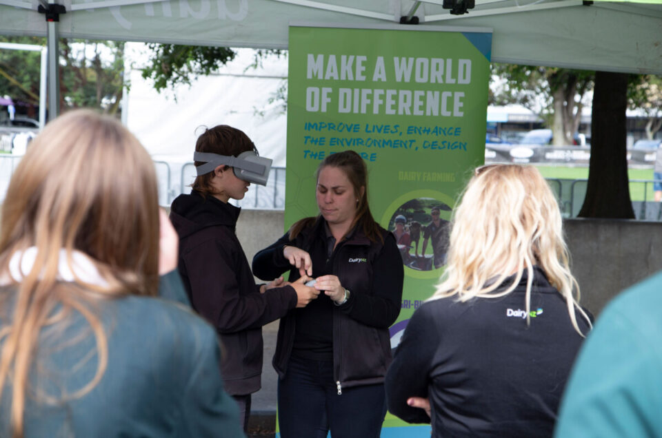 Person using VR headset at the Make a World of Difference tent