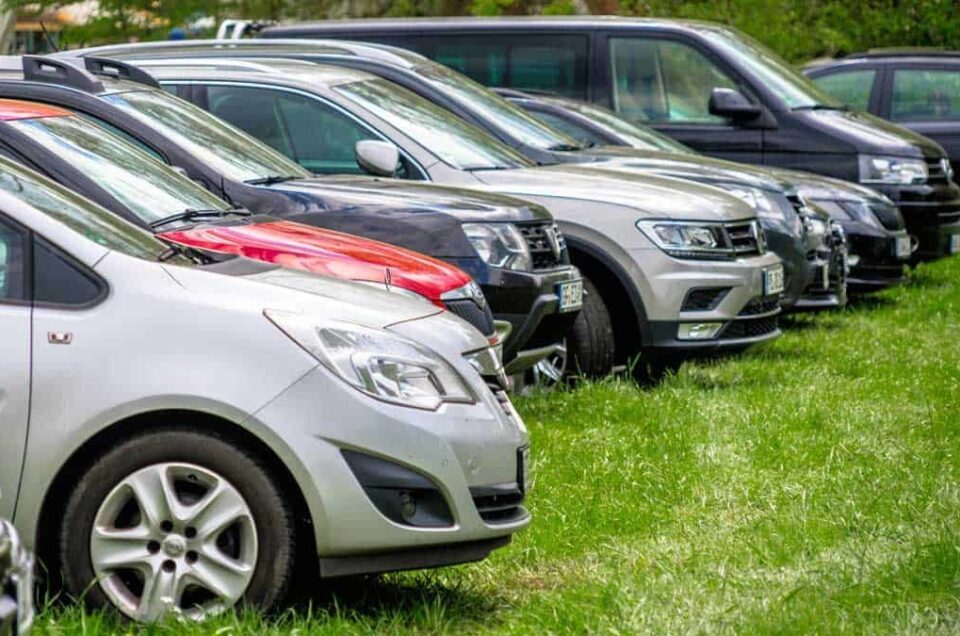 Cars parked on grass