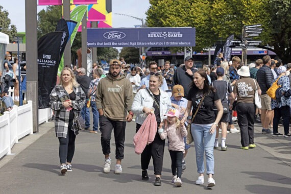 A family walking through the Rural Games entrance.